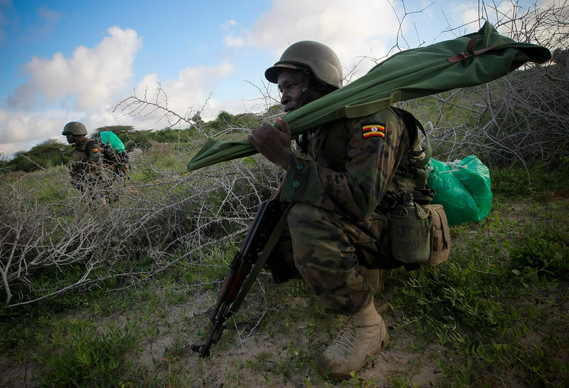Soldiers serving with the African Union Mission in Somalia AMISOM take up position along a road 22 May 2012 during a joint AMISOM and Somali National Army SNA