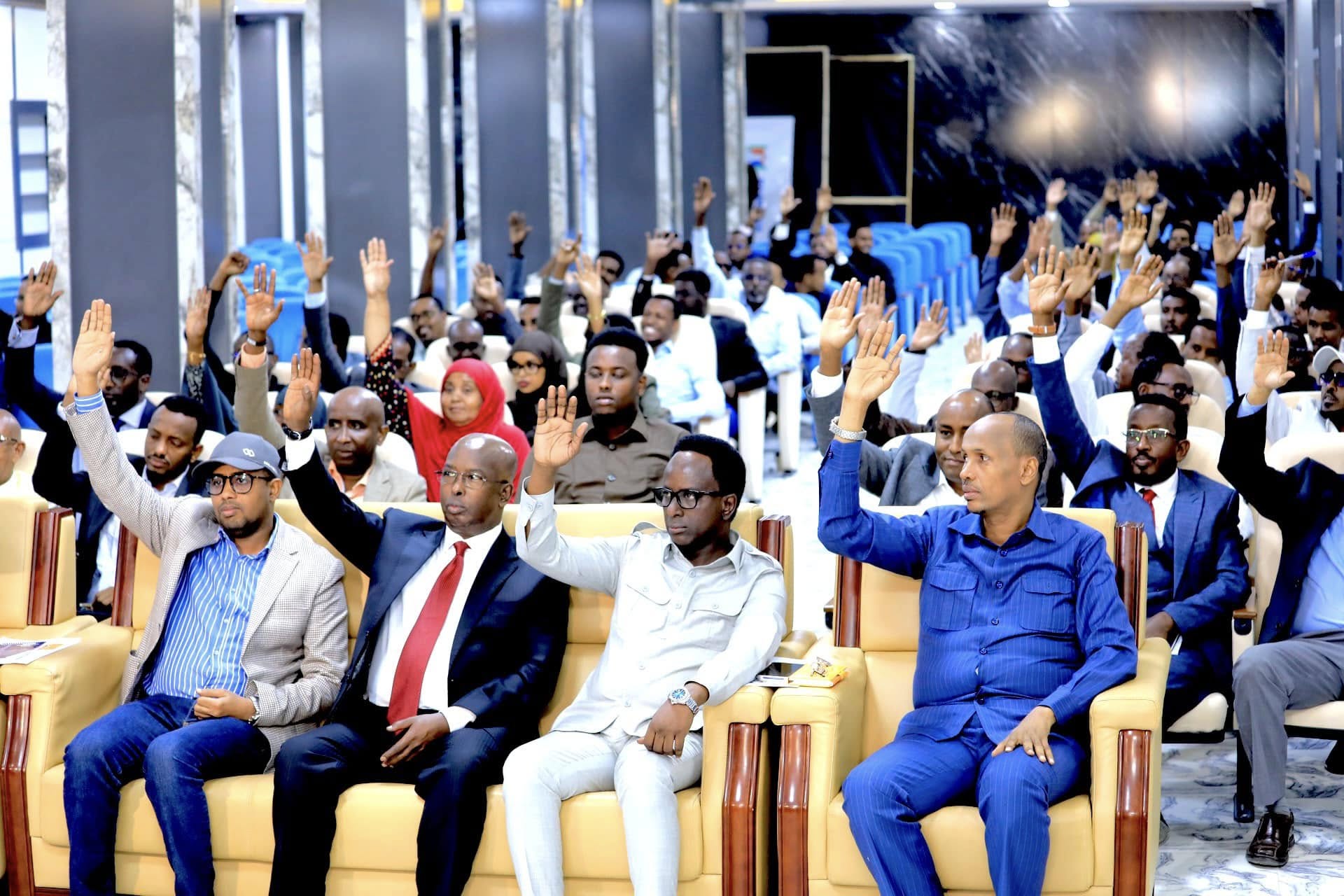 Members of the Banadir Regional Administration raising their hands to approve the 2025 budget during a session held at the Benadir Administration HQ in Mogadishu on December 30, 2024.