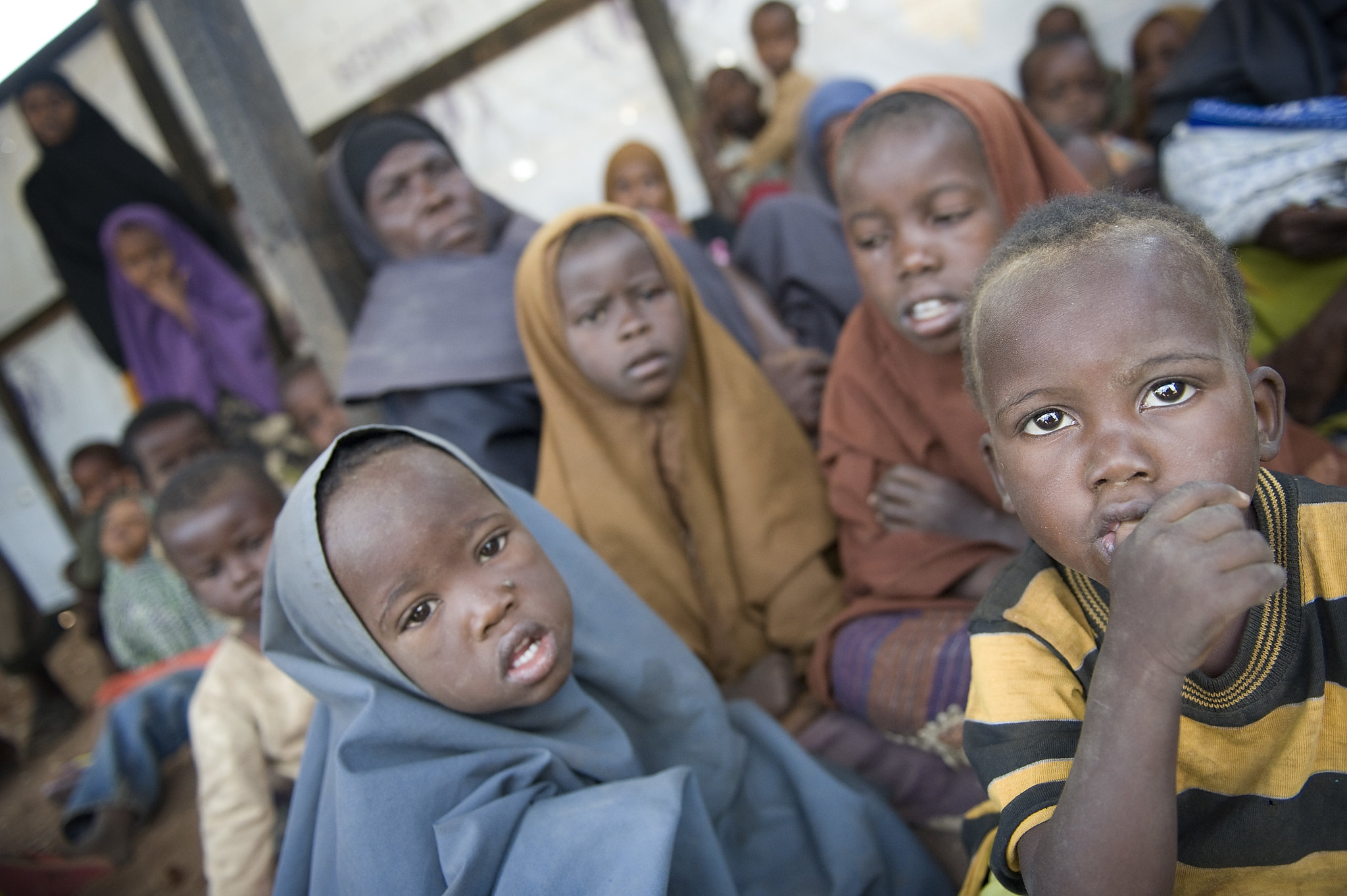 Fatumah Muhammed Abdi, 40, sitting with nieces, nephews, and an orphan child at the reception center in Hagadera refugee camp, Dadaab, Kenya, after fleeing famine in Somalia, August 25, 2011.