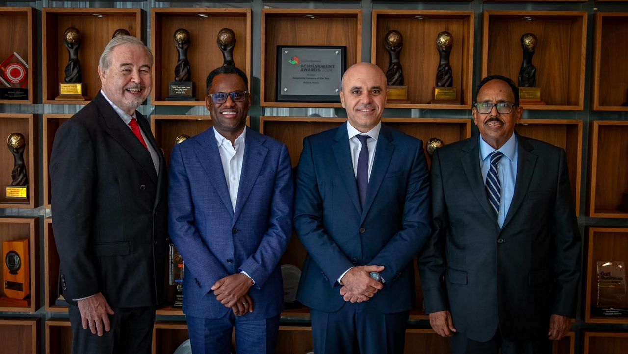 Four men stand together at a signing ceremony in Dubai on December 27, 2024. From left to right: Philip Barnes (CEO of Rotana), Jibril Hassan Mohamed (Chairman of Riverside Holding), Bani Haddad (Founder and Managing Director of Aleph Hospitality), and Husein Abdi Halane (Somali Ambassador to the UAE).