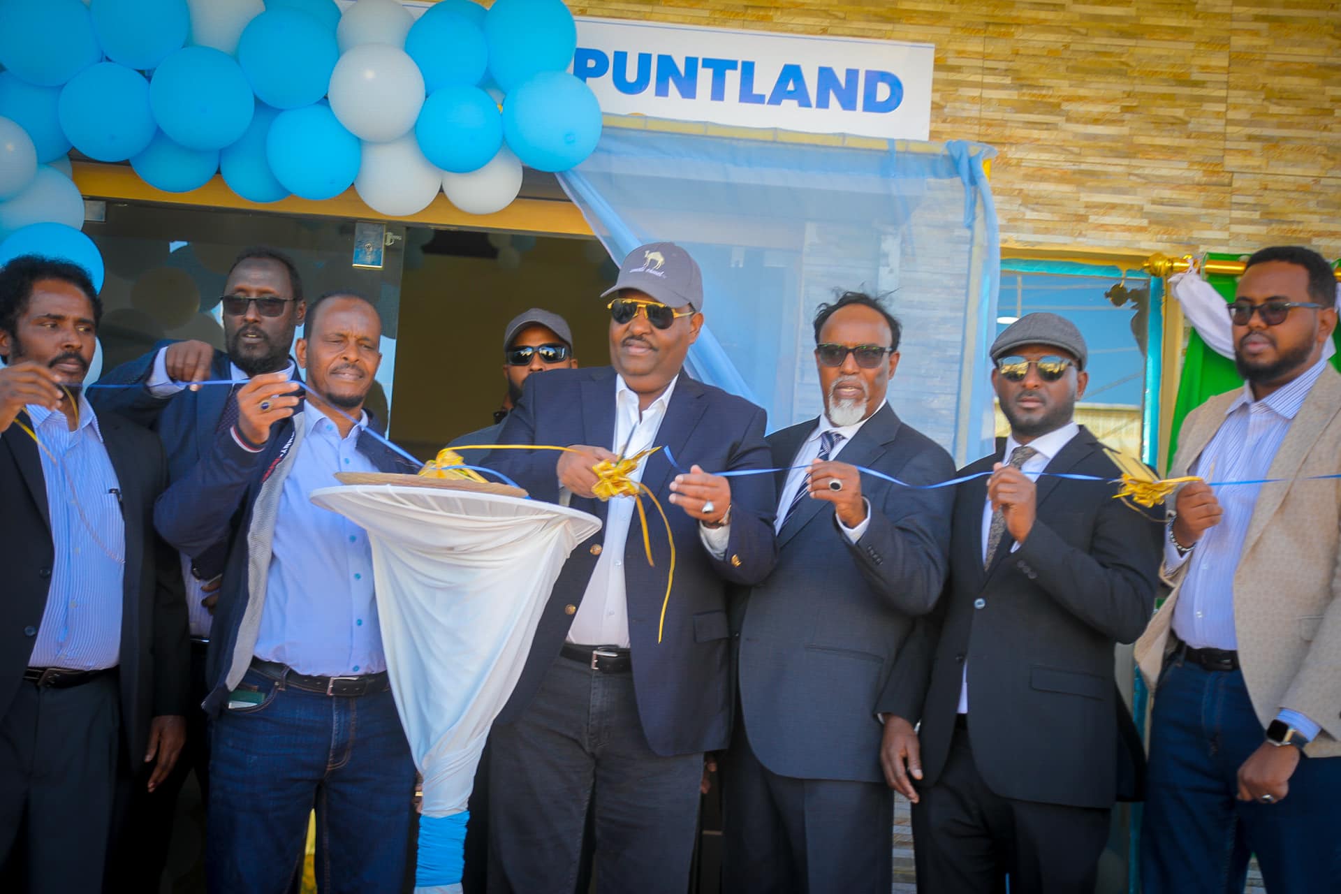 President Said Abdullahi Deni of Puntland cuts the ribbon at the inauguration of Puntland's Bank headquarters in Garowe, Somalia, on December 21, 2024. Photo courtesy of Puntland State House Facebook page