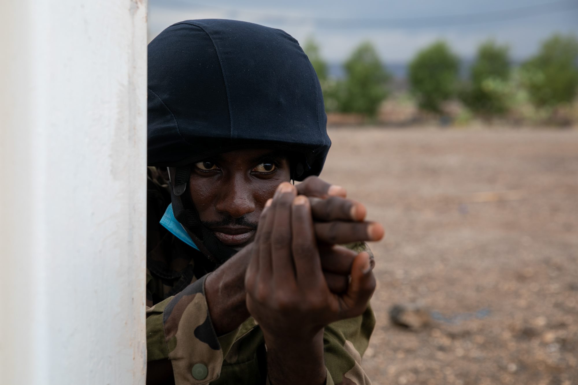 A Djiboutian Gendarmerie member demonstrates simulated security techniques during a medical knowledge exchange at the Gendarmerie compound in Djibouti City on January 17, 2022. Civil Affairs Soldiers from the Combined Joint Task Force - Horn of Africa observe and participate.