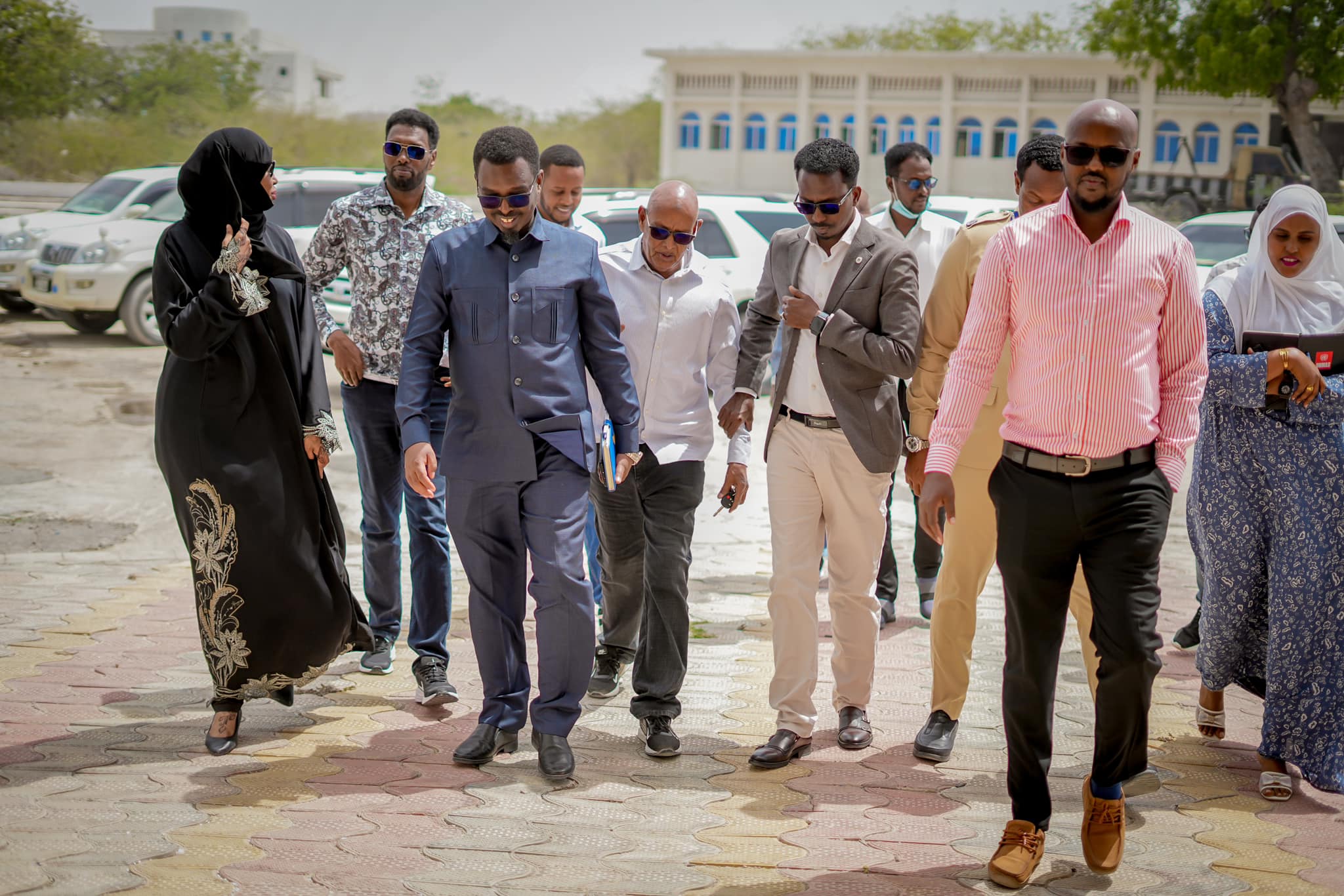 of Somalia’s electoral commission and election staff walking during a site visit to assess preparations for upcoming local council elections.