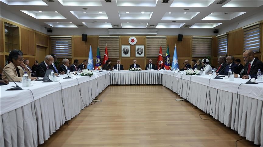 A high-level diplomatic meeting in Ankara, Turkey, featuring Somali, Ethiopian, and Turkish delegations seated around a conference table. Flags of Somalia, Ethiopia, and Turkey are displayed in the background.