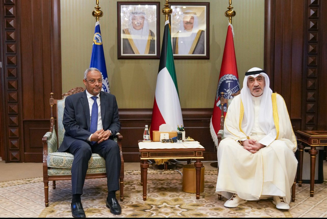 Djibouti’s Minister of Foreign Affairs, Abdulkadir Hussein Omar, and Kuwait’s Acting Prime Minister Sheikh Fahad Youssef Al-Sabah seated during a formal meeting with national flags in the background.